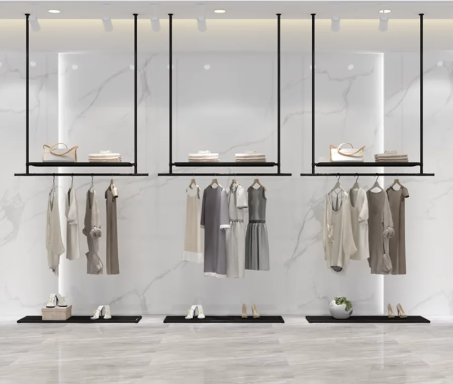 The clothes hanger on the ceiling of the clothing store is a display stand hung on the wall