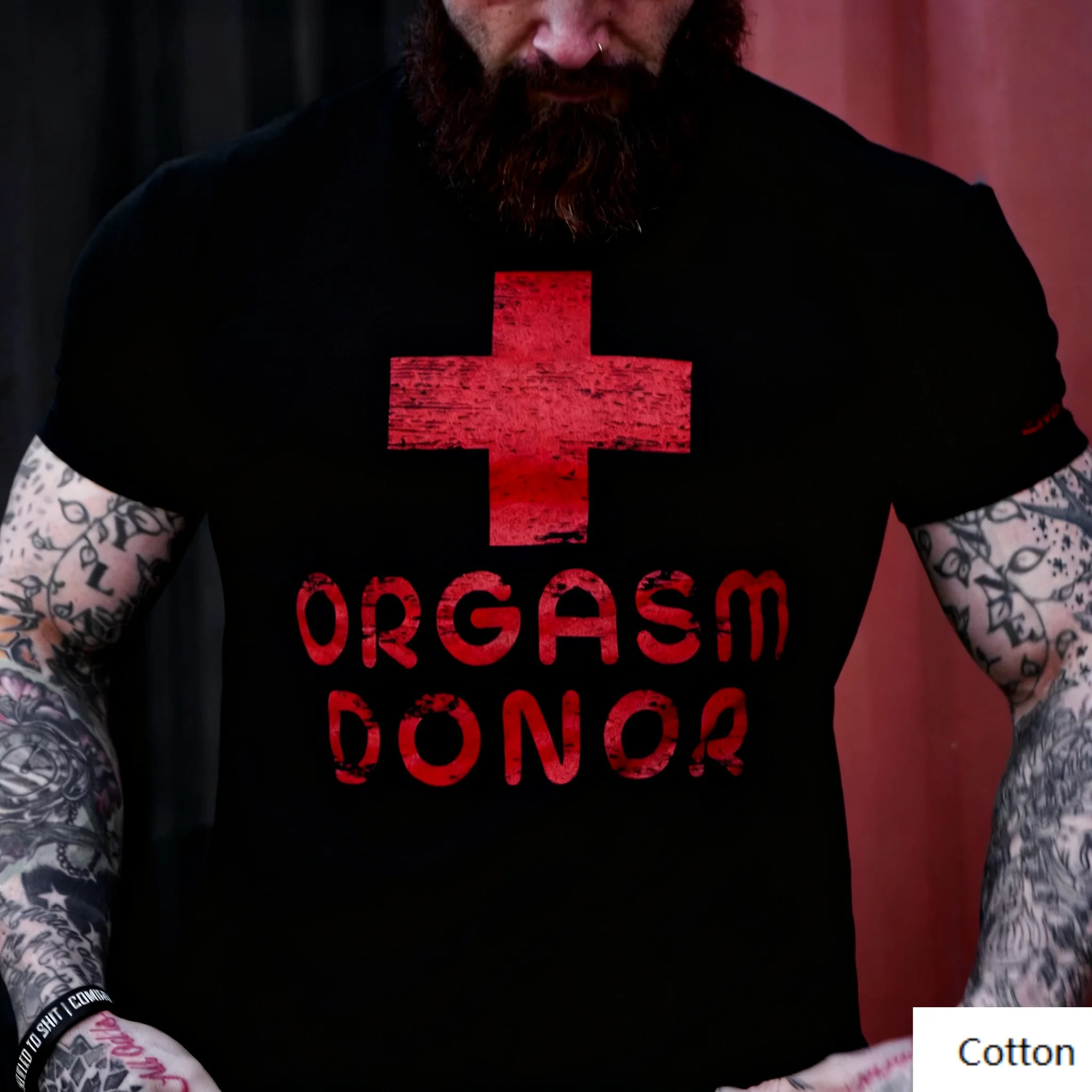 

“Edgy 'Orgasm Donor' Red Cross Vibe” Cotton Crew Neck T - Shirt Content: Featuring A Distressed Red Cross and The Bold Phrase