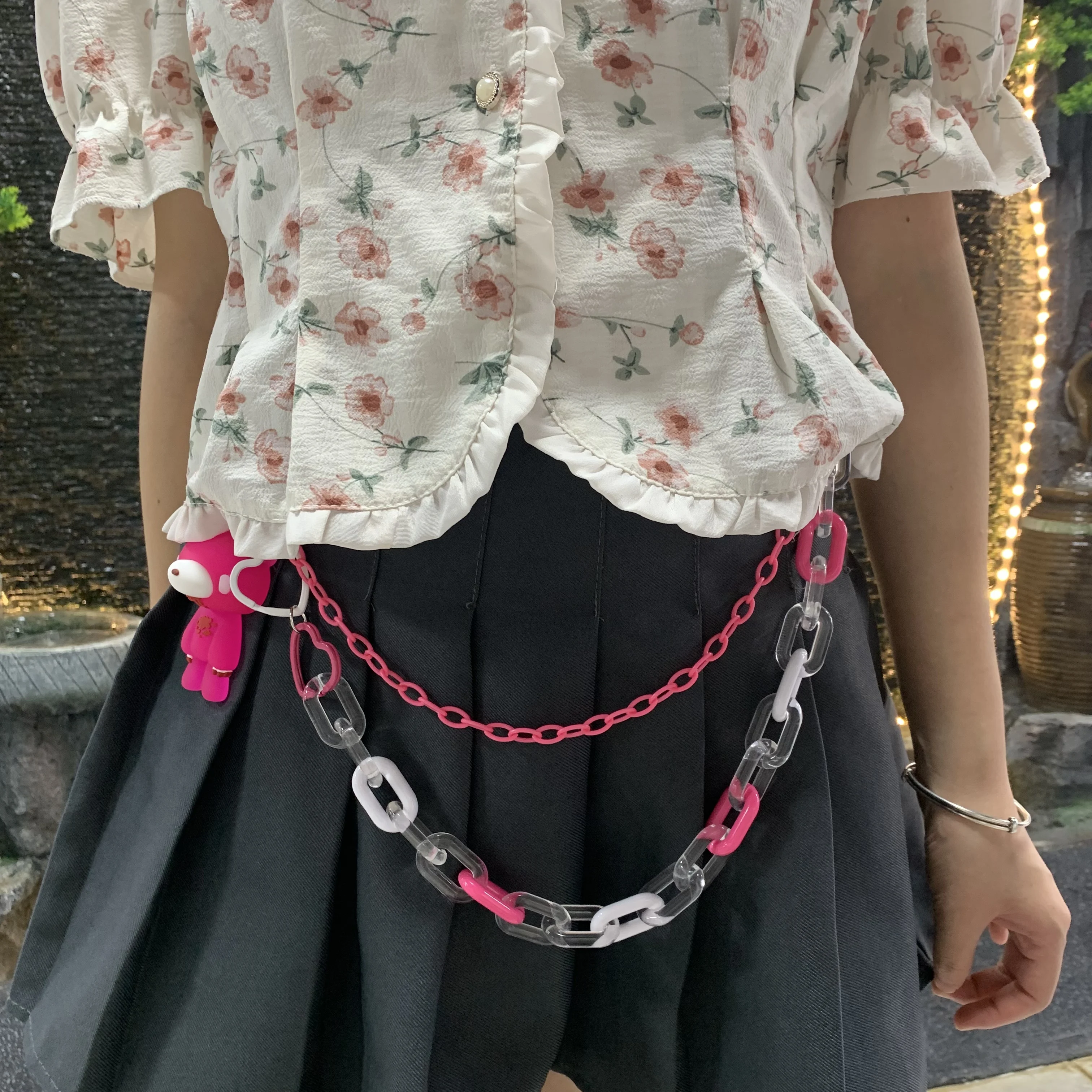 This pink bear - pendant pants chain, with mixed clear & pink links, adds a cute - edgy vibe. Perfect for styling outfits.