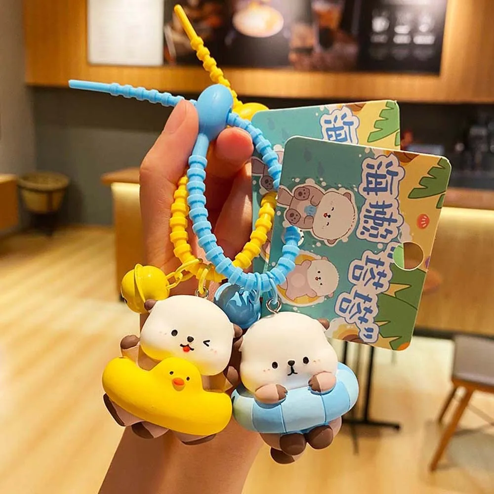 PVC Animals Doll Cartoon Otter Keychain Swimming Ring Bell Holding Fish Shape Otter Bag Pendant Keys Accessories Portable