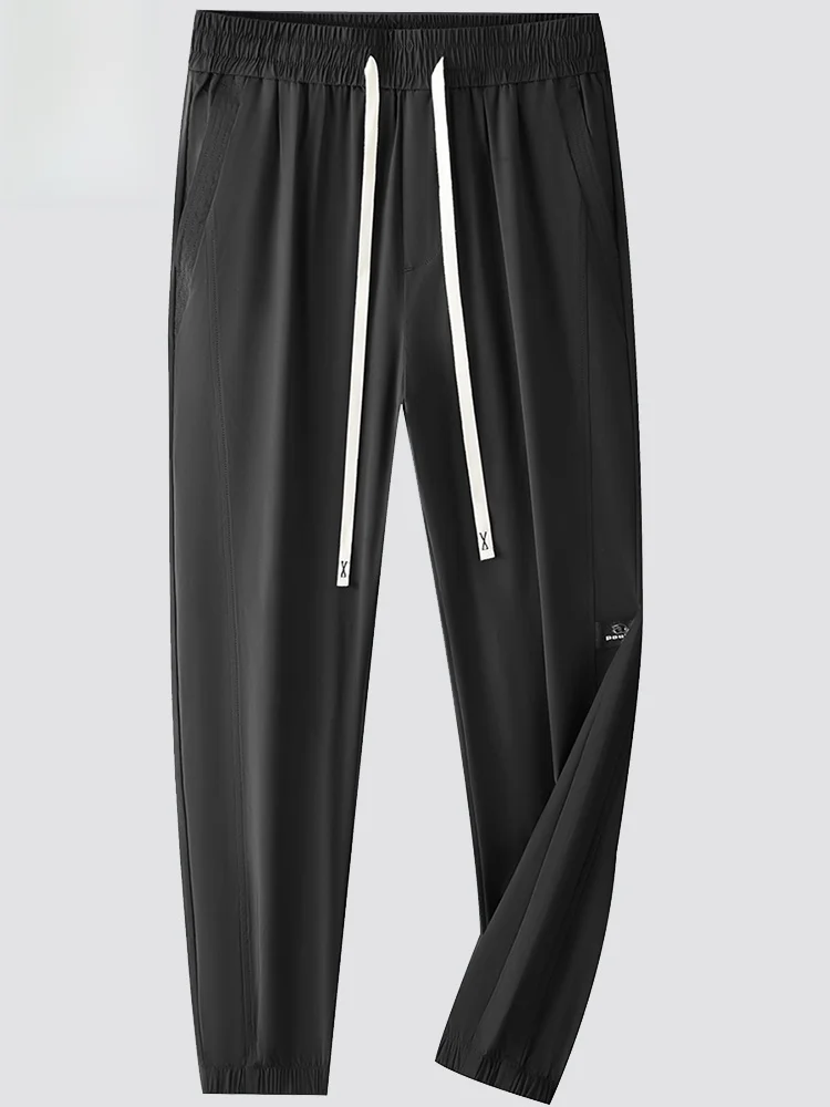 

Молодежные модные тонкие мужские спортивные брюки больших размеров из ледяного шелка, быстросохнущие, с широким поясом, свободные, с манжетами, эластичные, повседневные