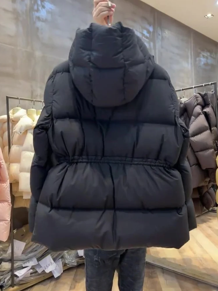   เสื้อโค้ทพัฟเฟอร์ผ้าฝ้ายมีฮู้ดสำหรับผู้หญิง รุ่นเกาหลี ทรงหลวม แขนยาว สไตล์เกาหลี รุ่นบางเบา เหมาะสำหรับฤดูหนาว