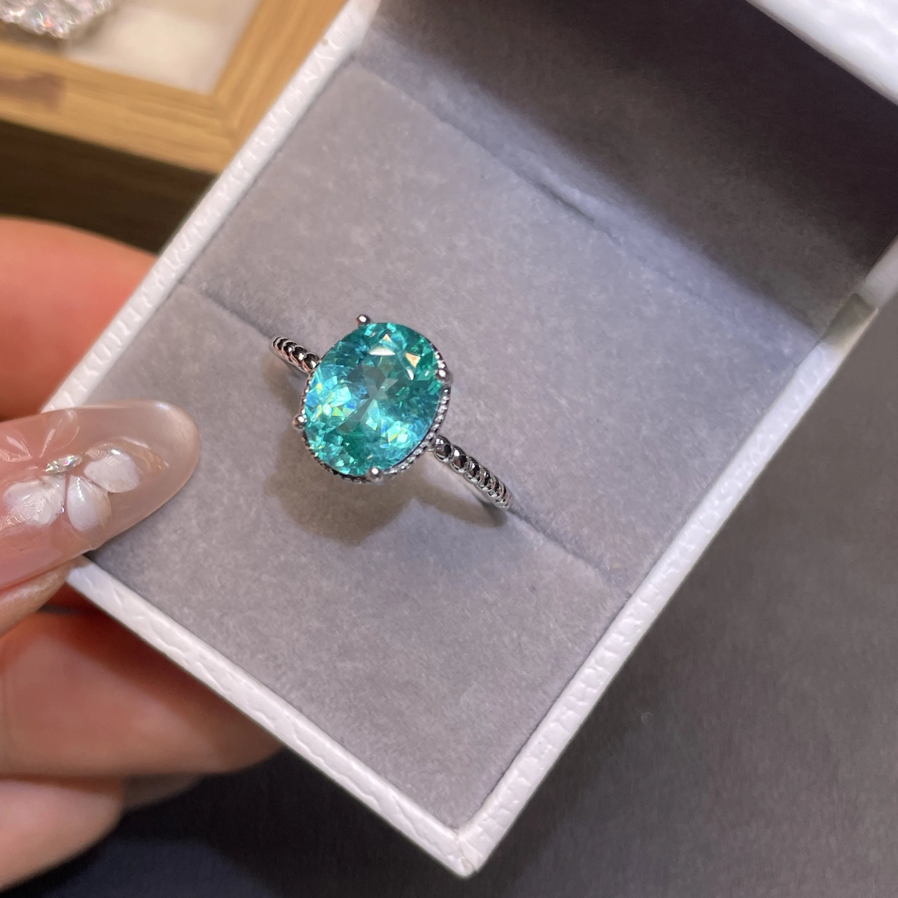 Simple Paraiba single gemstone ring. Wedding and engagement ring designed for women. Silver jewelry with adjustable design