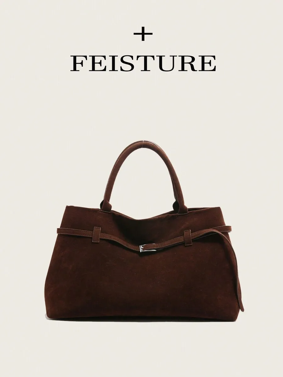 

Большая сумка-тоут из коричневой замши с верхней ручкой, ремешком на пряжке и магнитной застежкой