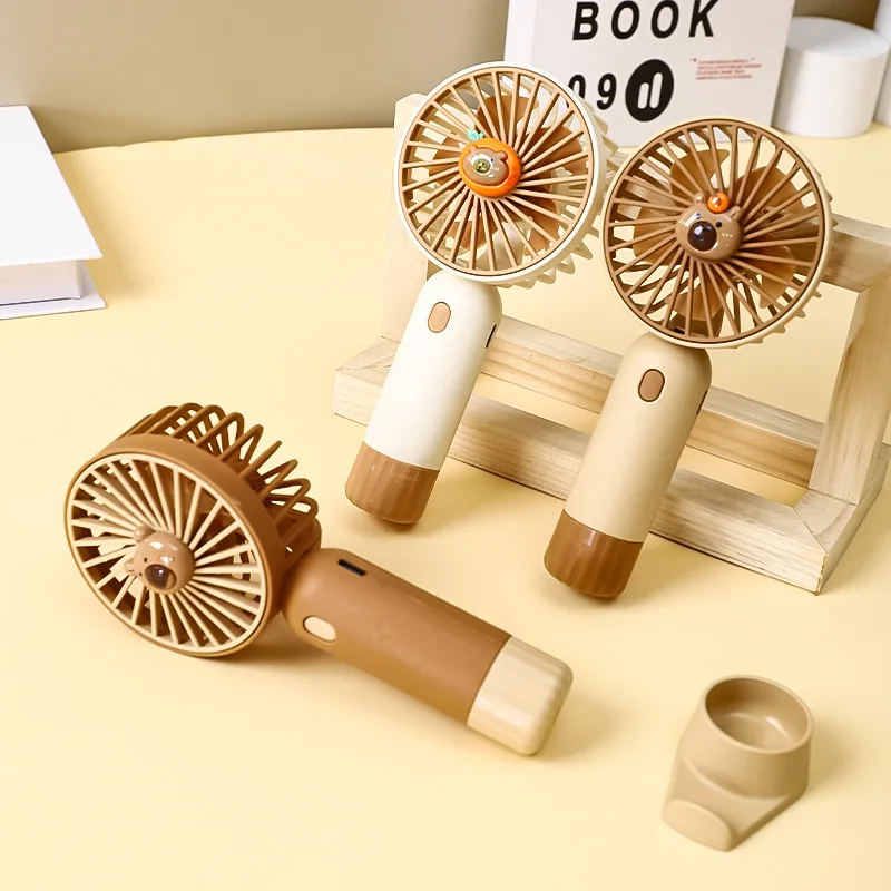 

Handheld fan USB charging small fan Capibala learning office desktop small electric fan mute