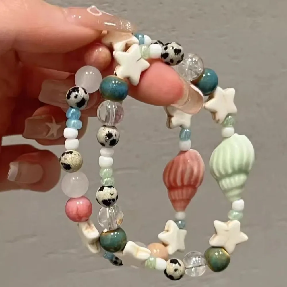 Bonita y exquisita pulsera de cuentas de cerámica colorida con estrella de concha bohemia para mujer, estudiante, vacaciones en la playa, accesorios de joyería, regalos