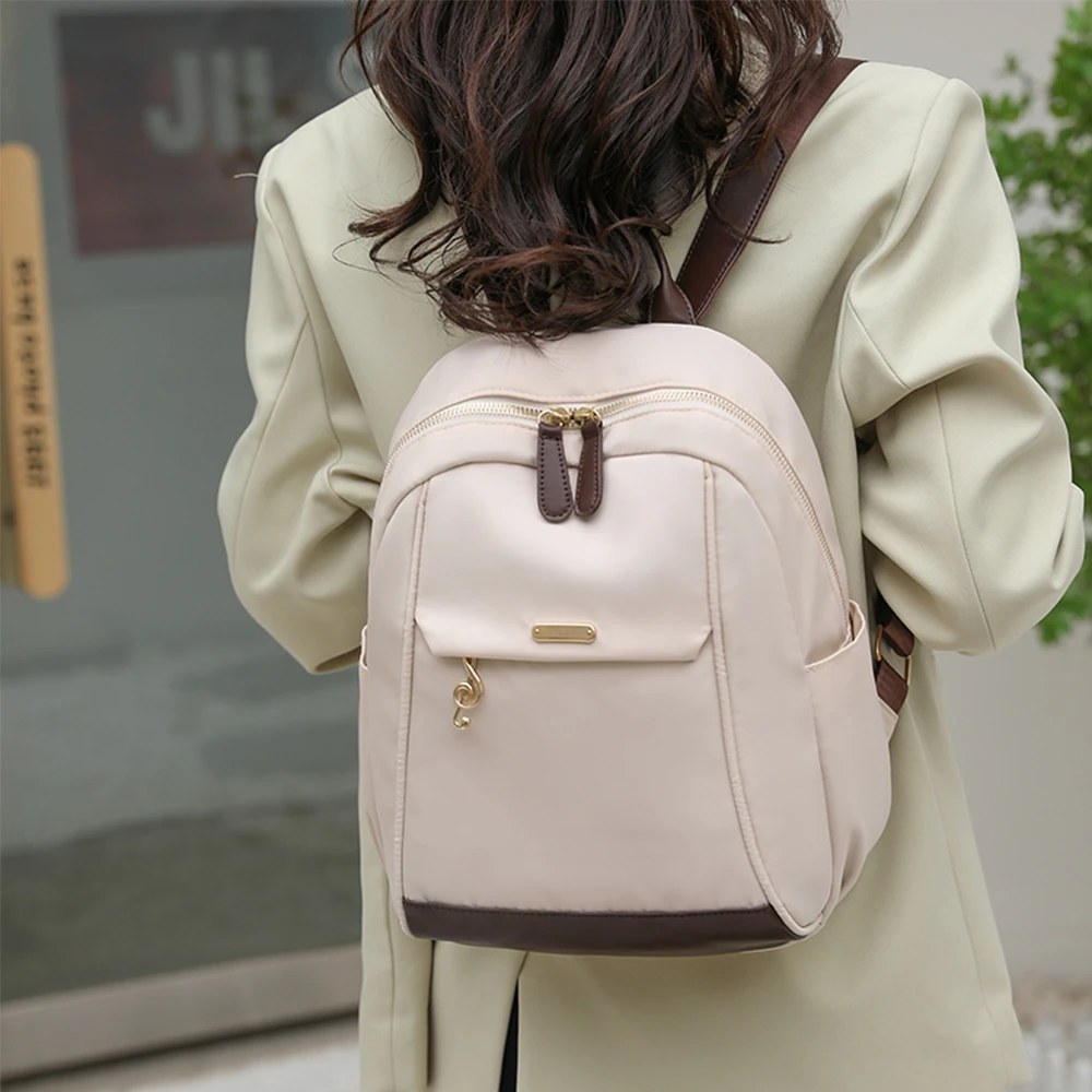 Mochila De Color liso para Mujer, bolso De nailon De alta calidad a la moda para estudiantes, nuevos bolsos De viaje De gran capacidad para Mujer, Mochilas De Mujer