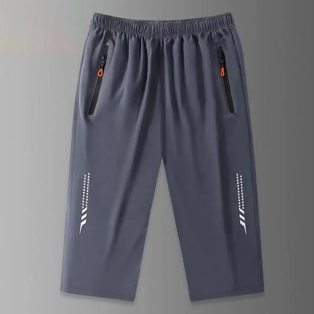 Celana musim panas Breathable pria, celana atletik cepat kering dengan saku ritsleting dan celana kaki lebar sutra es untuk aktif