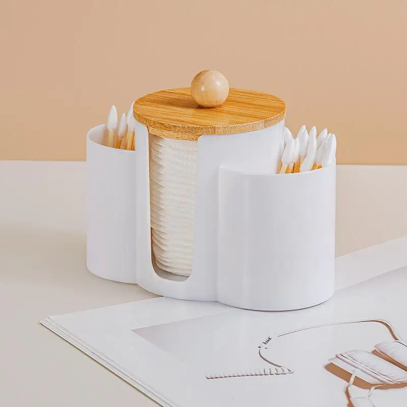 Esta caixa de armazenamento de almofadas de algodão 3 em 1 pode armazenar almofadas de algodão, almofadas removedoras de maquiagem, palitos de dente, palhetas de fio dental, sopros de pó, etc.