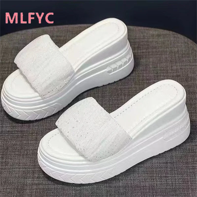 

Slope heeled thick sole fashionable and elegant women's slippers with pleated flat sole and open toe sandals