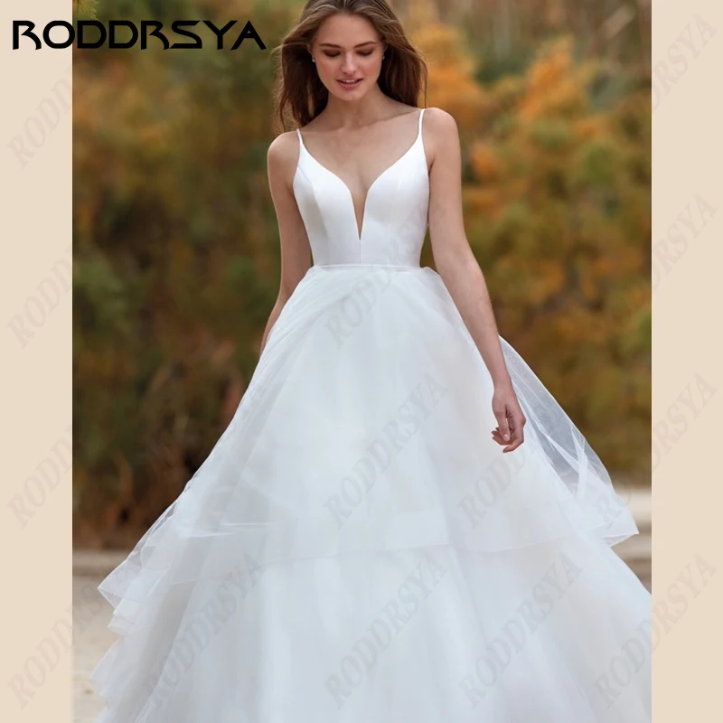 RODDRSYA Correias De Espaguete Vestidos De Casamento V-Neck Satin A-Line Vestidos De Noiva Tulle Lace Backless Praia Noiva Festa Robe De Mariée Correias De Espaguete Vestidos De Casamento V-Neck Satin A-Line Vestidos D