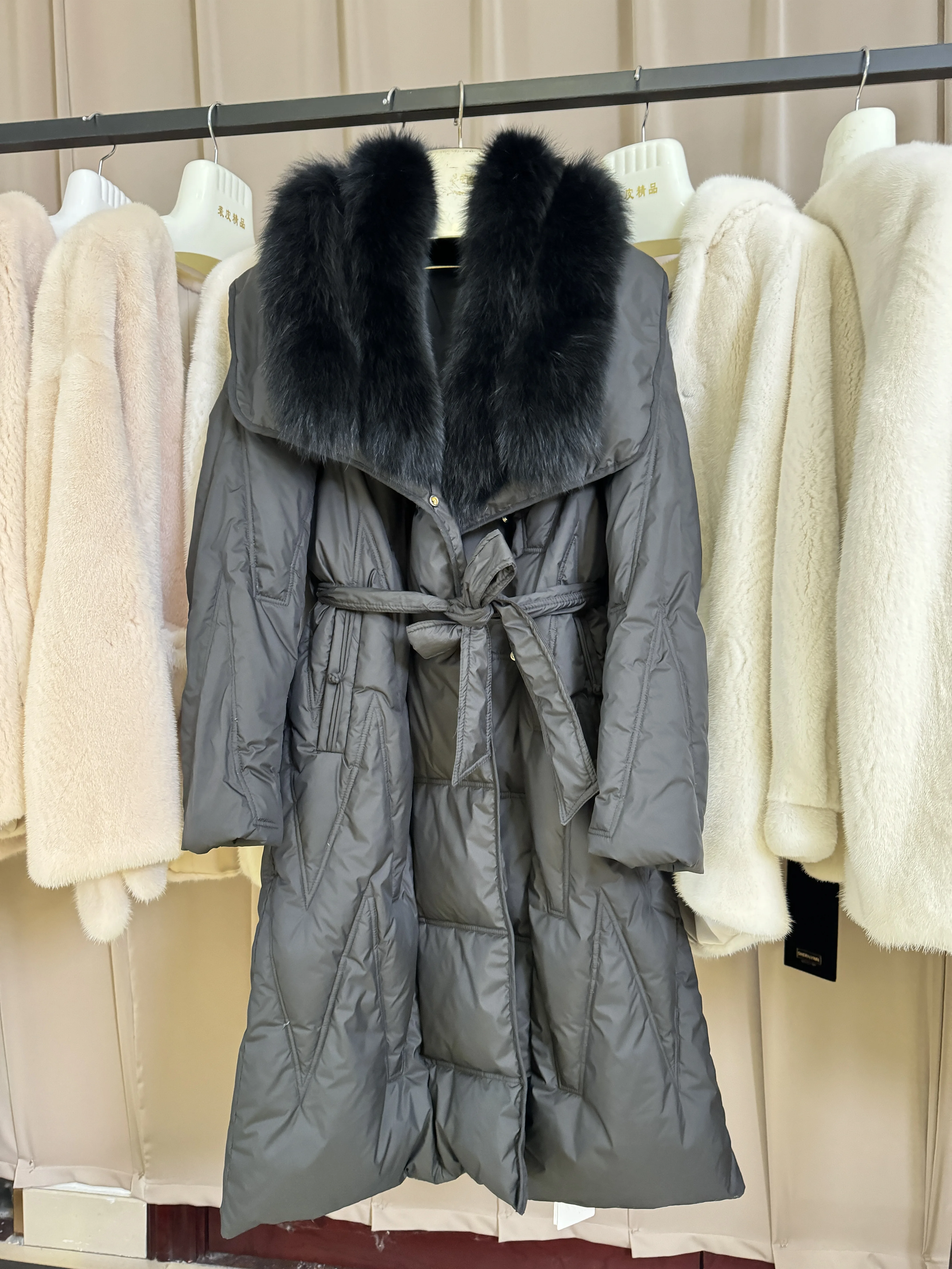 Designer women down parkas 2024 winter fashion long warm coat with belt and real wolf collar