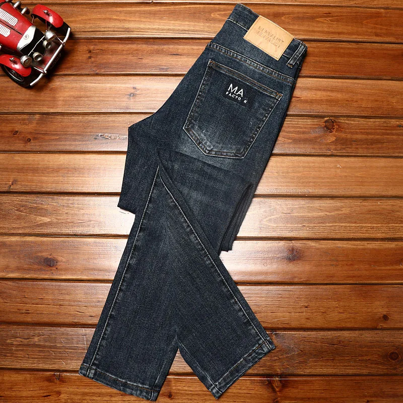 Jeans classici semplici pantaloni Casual versatili dritti larghi alla moda da uomo pantaloni da lavoro elasticizzati di grandi dimensioni lavati retrò autunno