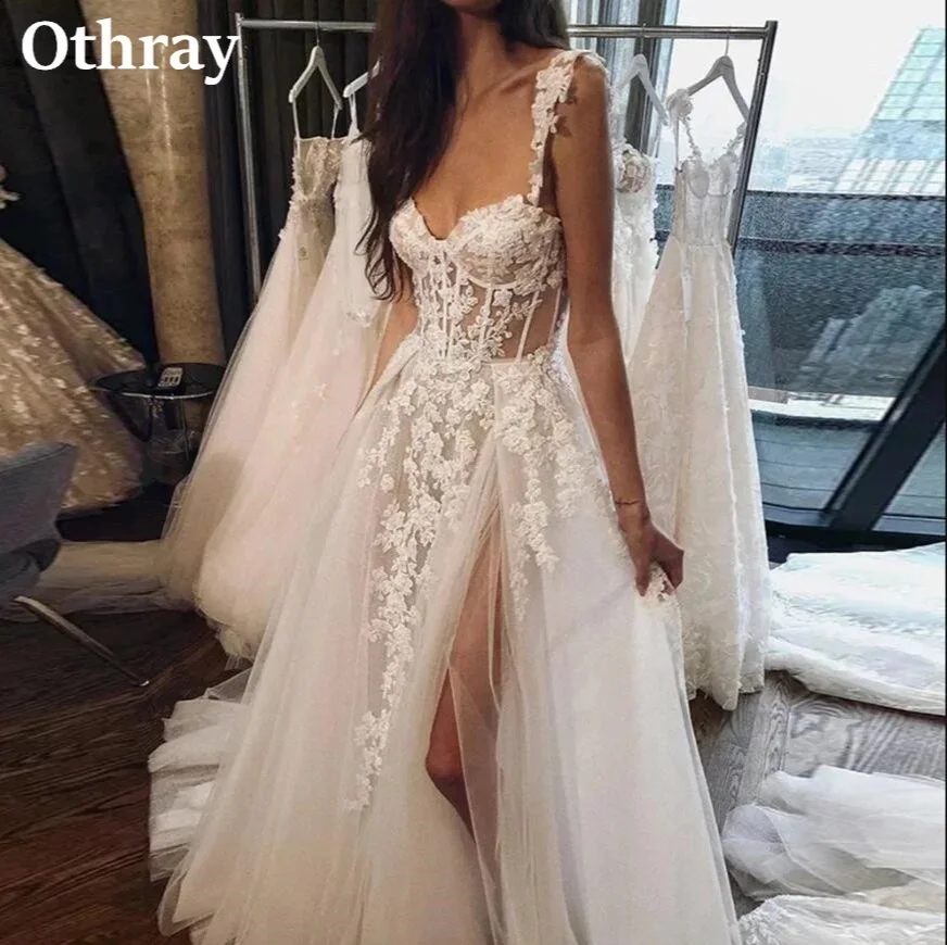 فساتين زفاف كلاسيكية من الدانتيل بتصميم A-line مع صدرية شفافة وأشرطة وظهر مفتوح، فساتين عروس ساحرة للحفلات في الحدائق مع شق جانبي