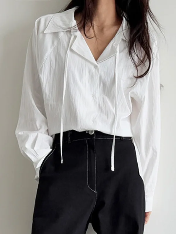 シックな春アンチエイジング長袖ルーズフィット女性のシャツリボンデザインピュアカラー多用途シングルボタンターンダウンカラー
