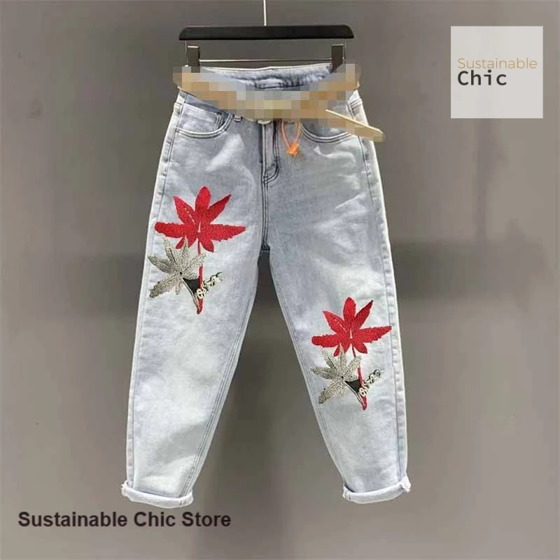 

American embroidered maple leaf denim harem pants women's wild slim high waist fashion wild nine pants in spring and autumn.