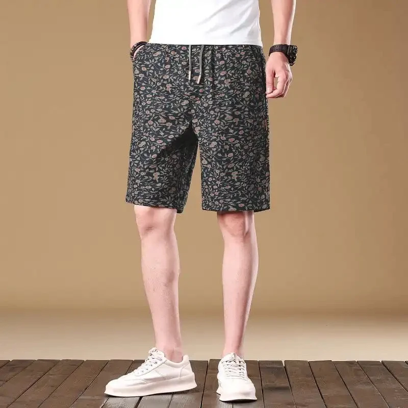 Casual summer floral shorts for men, loose fit with drawstring, simple American retro-style beach pants.
