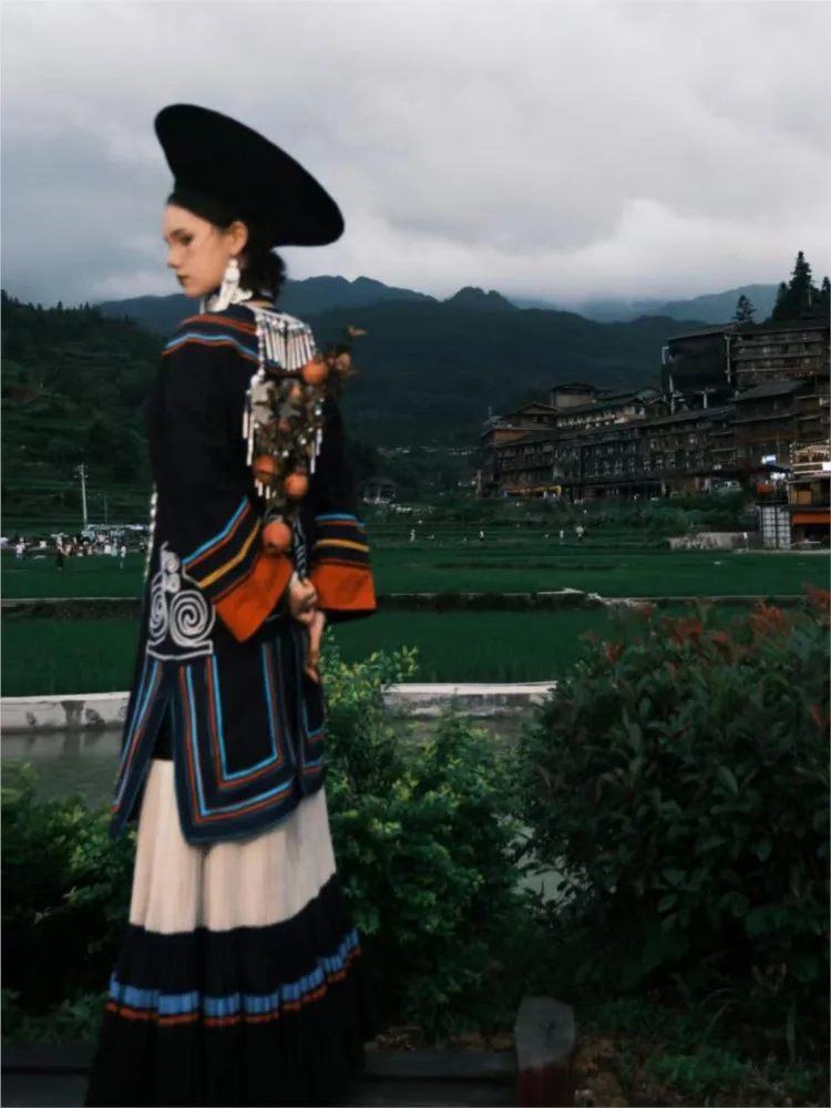 New photography of traditional women's striped cotton and linen costumes for the Torch Festival performance