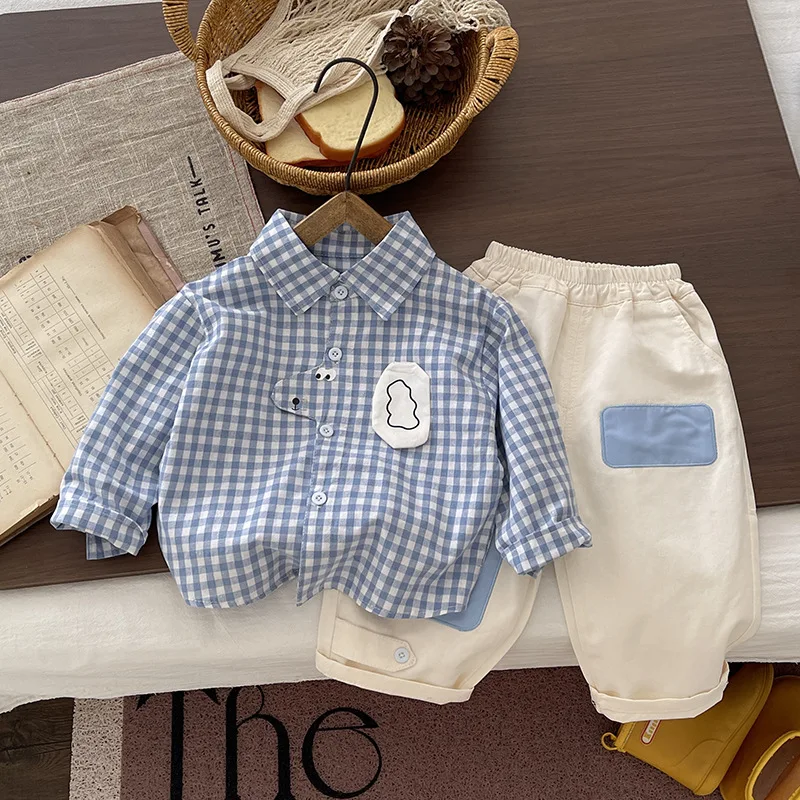 New stylish autumn and spring outfit for boys: plaid cotton shirt, sweater vest, and pants – a three-piece set in a preppy style