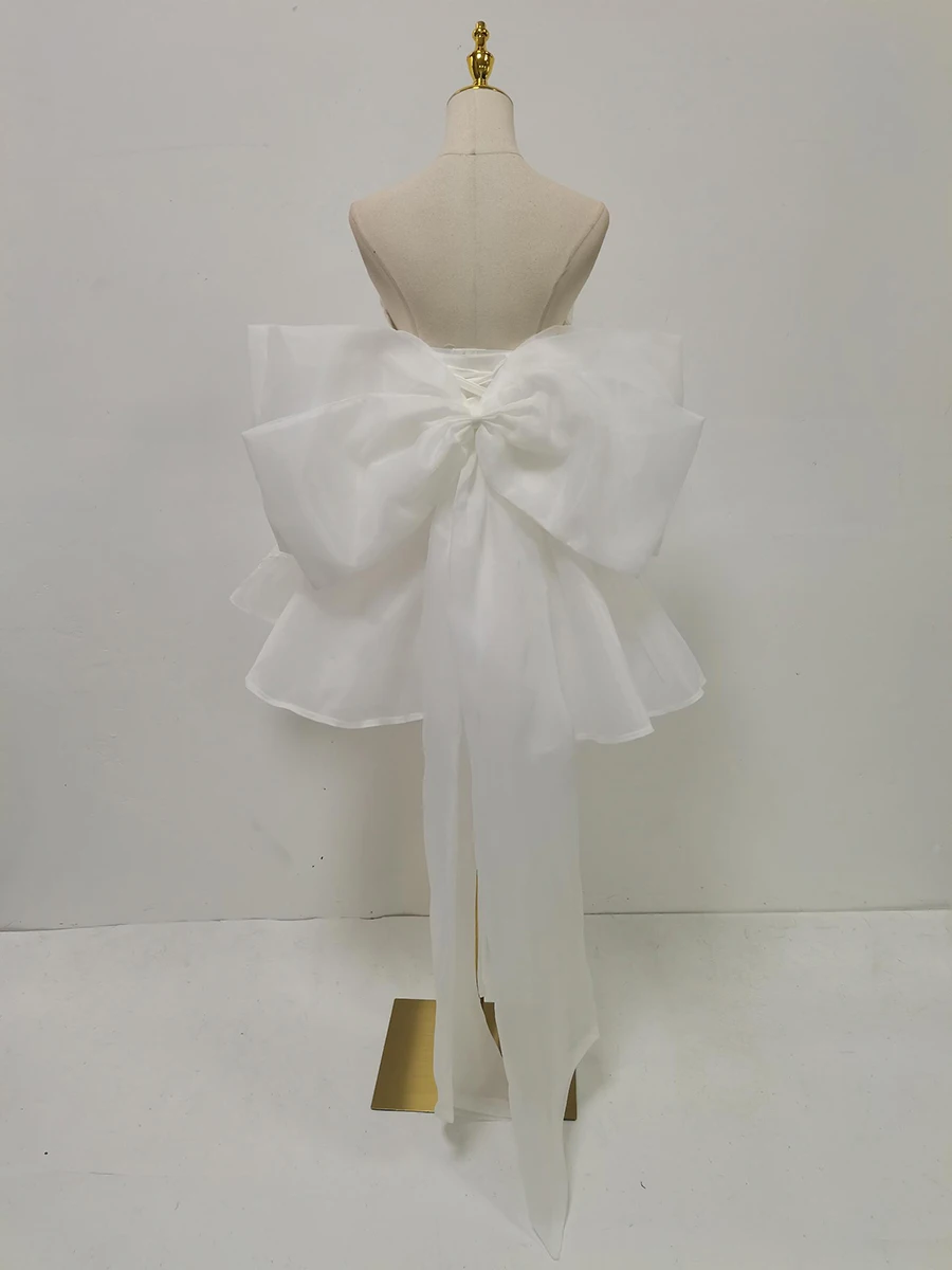 TWOTWINSTYLE solide épissé maille nœud papillon robes douces pour les femmes sans bretelles sans manches taille haute élégant Mini robe femme nouveau