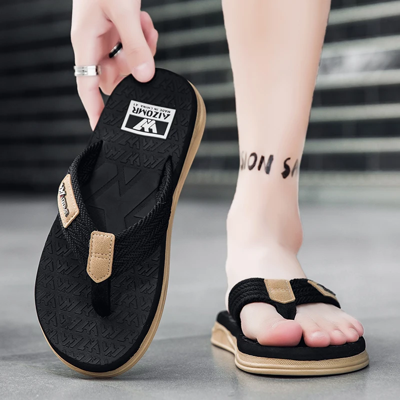 Essential for fashion-conscious men: lightweight, slip-resistant man-made flip-flops for summer, perfect for beach vacations.