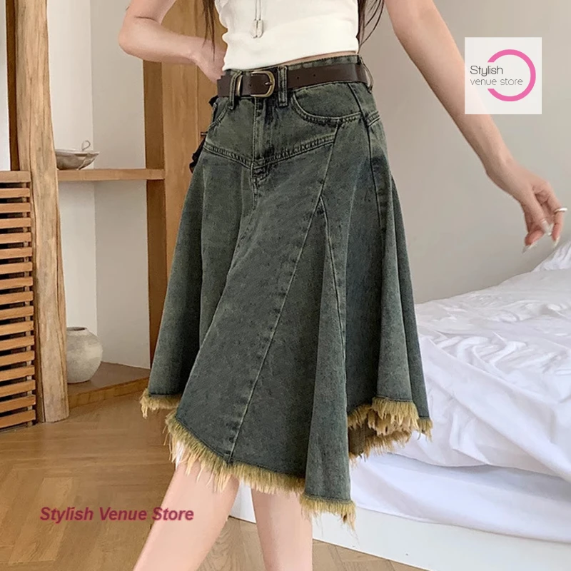 

American style retro irregular denim skirt women's autumn and winter new fashion design high waist Joker leisure tassel skirt.