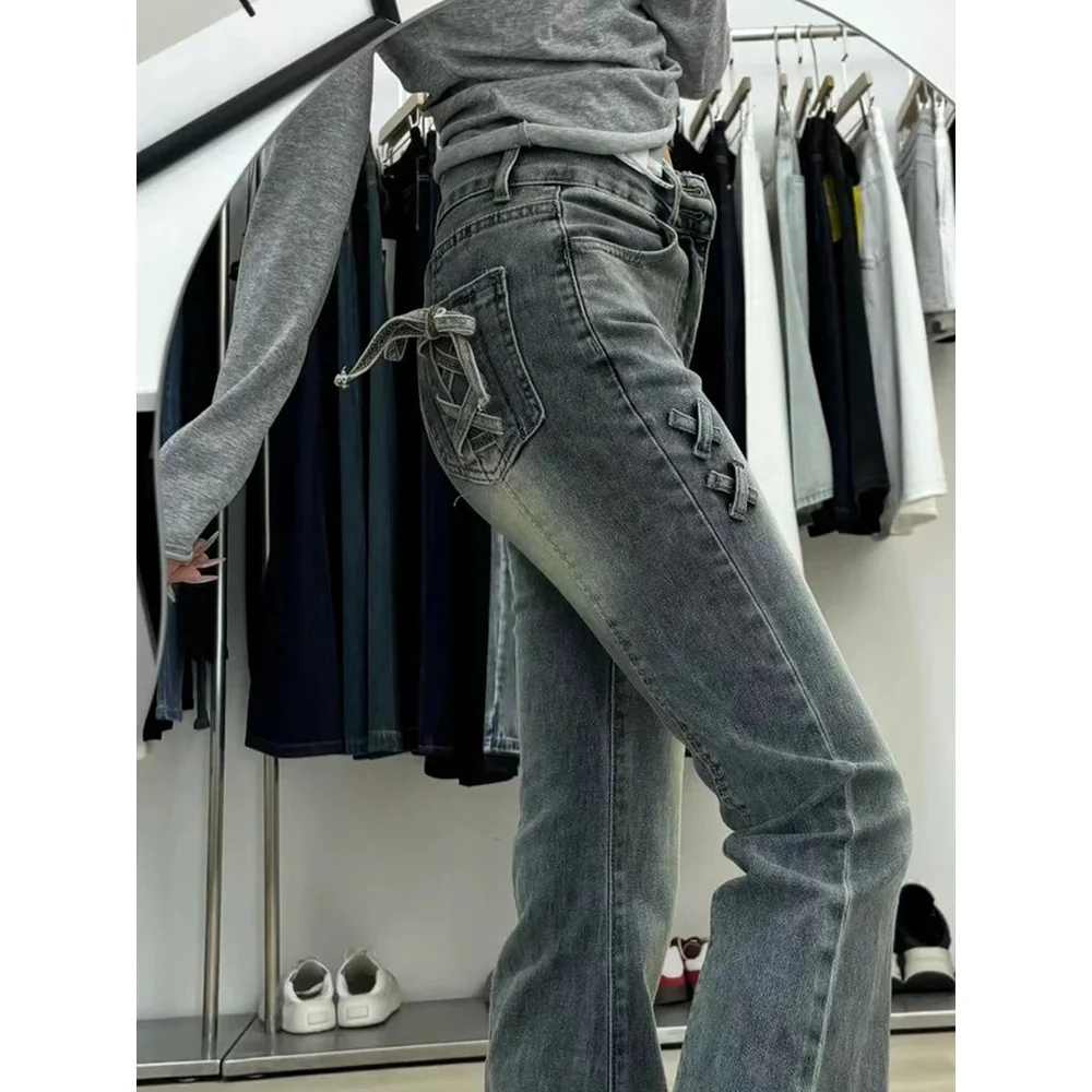 Retro blauwe slanke uitlopende jeans dames oversized Amerikaanse stijl hoge taille bandage boog ontwerp jeans denim broek met klokbodem