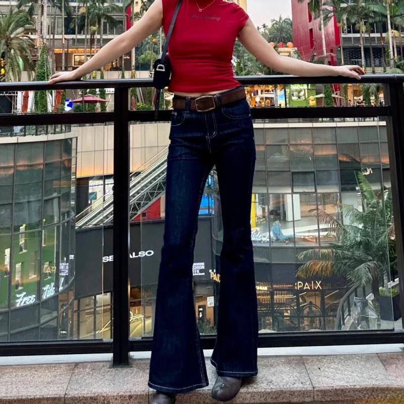 

Американские винтажные джинсы-клеш темно-синего цвета для женщин, с низкой посадкой, видимыми швами, облегающие и стройнящие, с расклешенными штанинами.