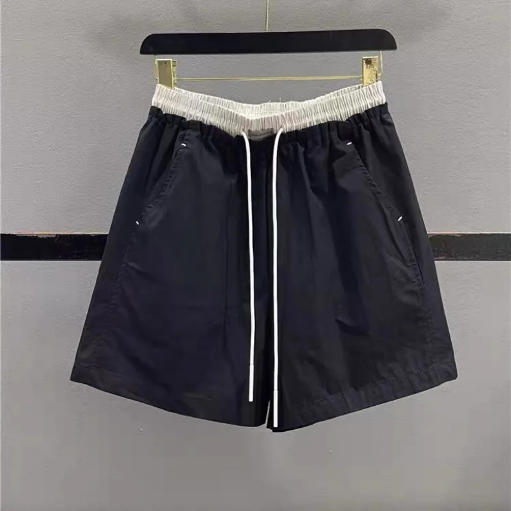 

Simple and Stylish Splicing Elastic Waist Drawstring Lace-up Casual Shorts Women's 2026 Summer Sports Wide-leg Short Pants