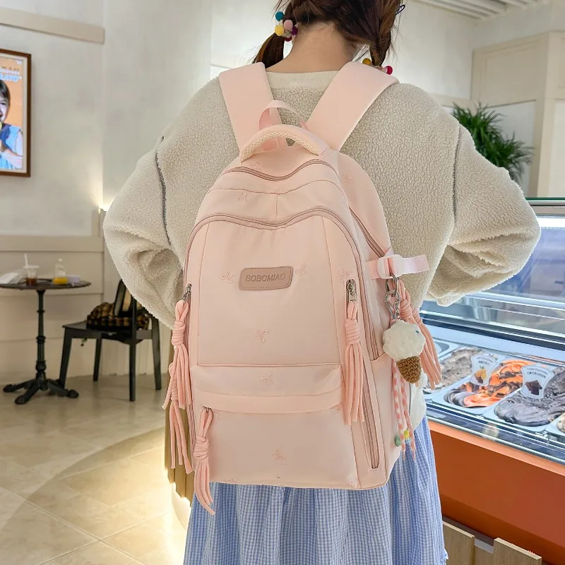 traveasy-brand-2026-new-bow-patterncute-versatile-backpack-nylon-tassel-pendant-spine-protection-schoolbag-for-students