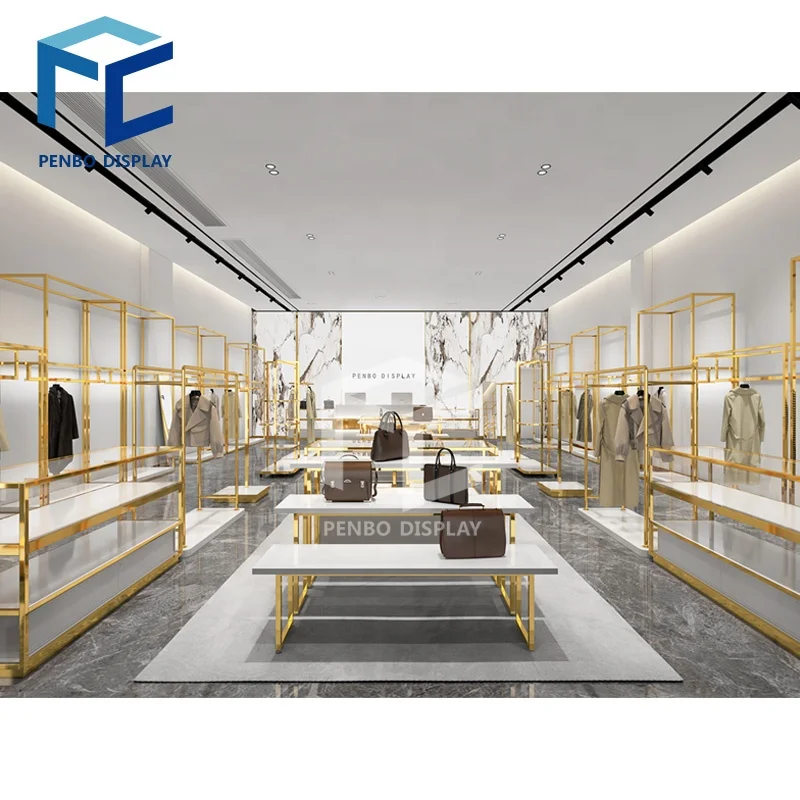 

CustomCustom Modern Garment Shop Clothing Display Table Shelf Gold Stainless Steel Shopping Mall Retail Cloth Display Racks For