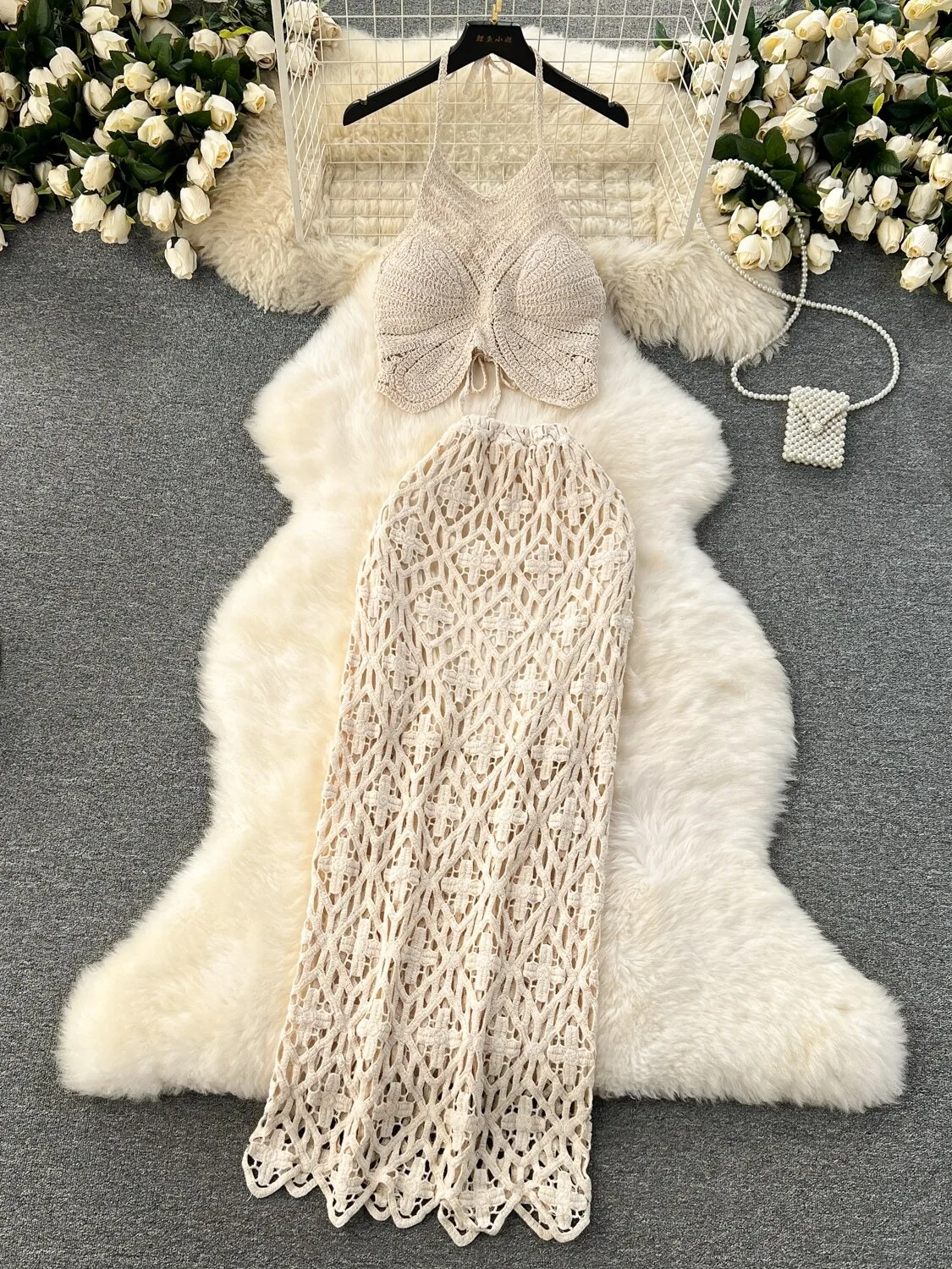 2026 new Bohemian vacation style hanging neck tank top sexy versatile retro hook flower hollow half skirt two-piece set
