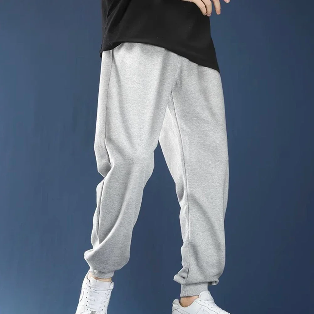 Męskie spodnie dresowe na co dzień polarowe spodnie sportowe moda unisex jednolite, luźne spodnie Streetwear jesienne zimowe spodnie do joggingu