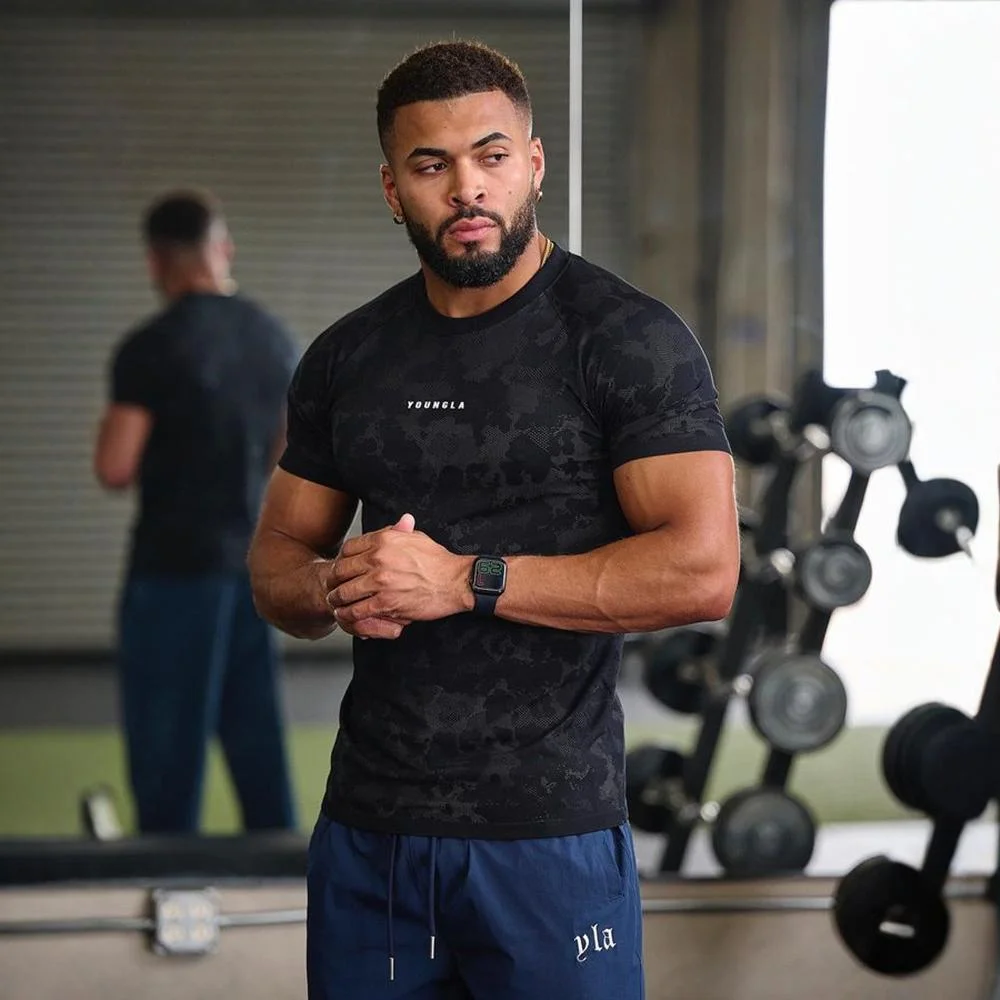 Nowe męskie t-shirty Fitness sportowy obcisła odzież Jogger siłownia kulturystyka Fitness bieganie trening Top z krótkim rękawem