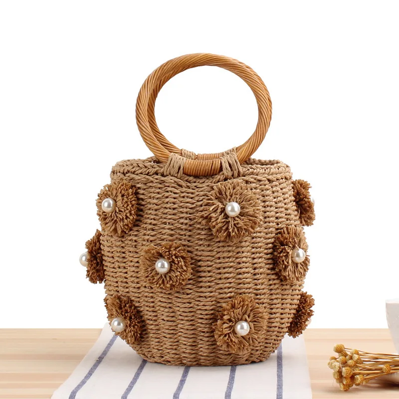 

New hand-woven straw bag Japanese and Korean bucket woven bag hand-woven flower Pearl beach handbag