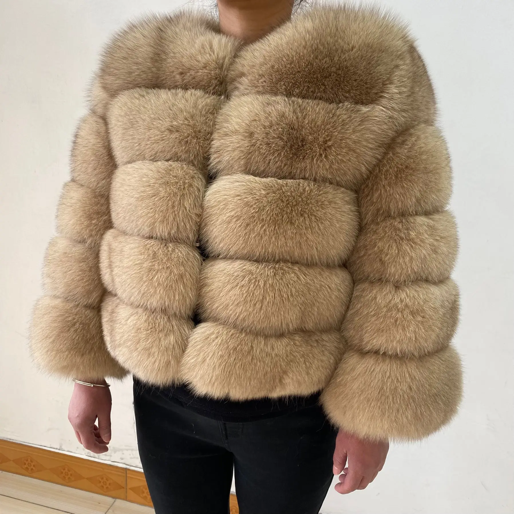 The lady's fashionable natural genuine fox fur women's winter fur coat. Fashionable fox fur natural fur women's coat. Genuine fo