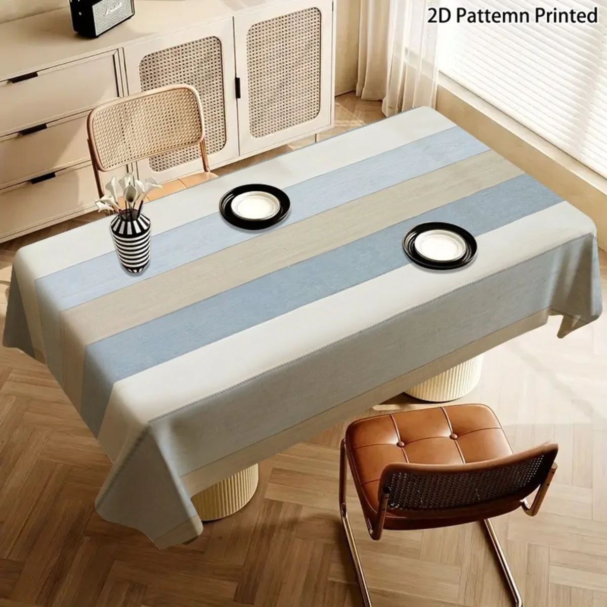 A soft, fashionable and attractive blue, white and beige striped tablecloth, machine washable and easy to clean.