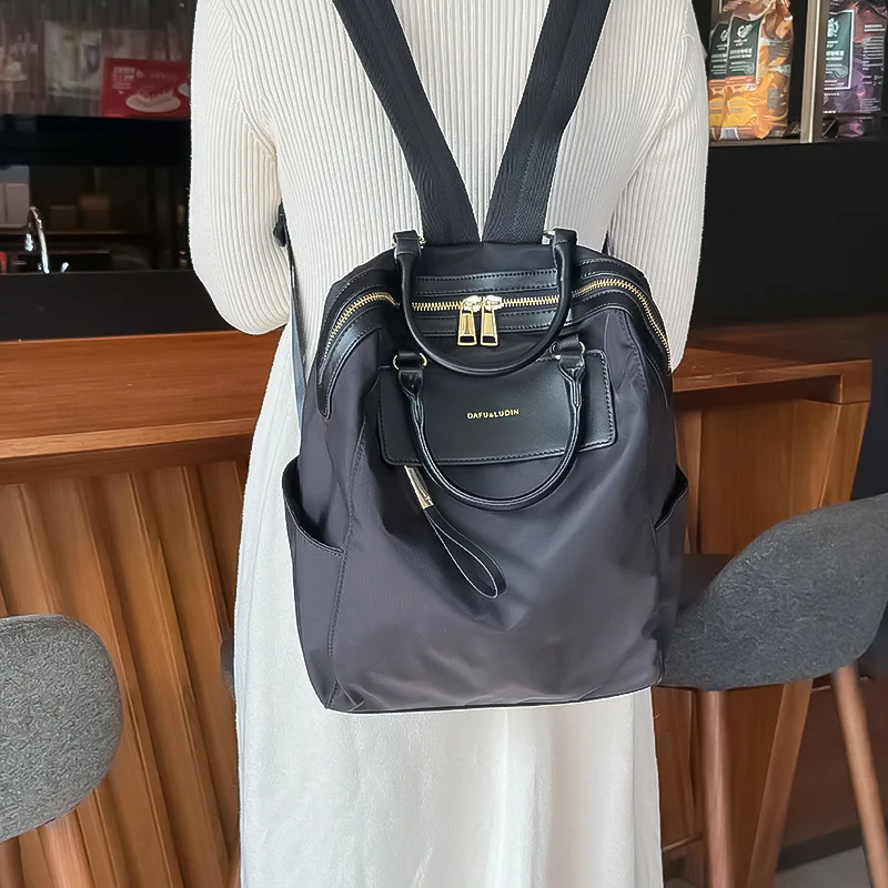 sac-a-dos-en-tissu-oxford-grande-capacite-sac-pour-femme-au-style-original-pour-les-trajets-quotidiens-et-les-cours-nouveau-style-d'ete-sac-de-voyage-decontracte