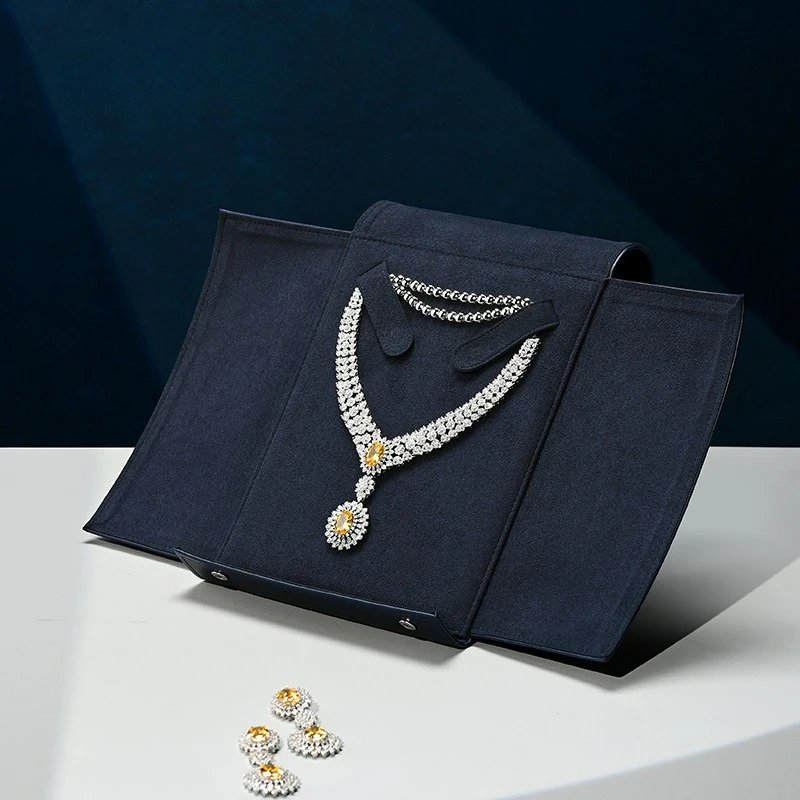 

Сумка для украшений из искусственной кожи, креативная складная сумка с застежкой, большая вместимость, для хранения ожерелий и украшений, портативная.