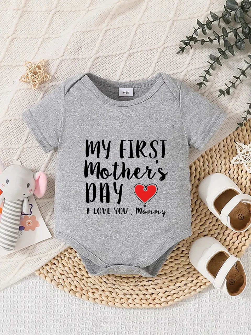 Playful letter-printed baby short-sleeve triangle bodysuit. Button closure for easy dressing, machine washable