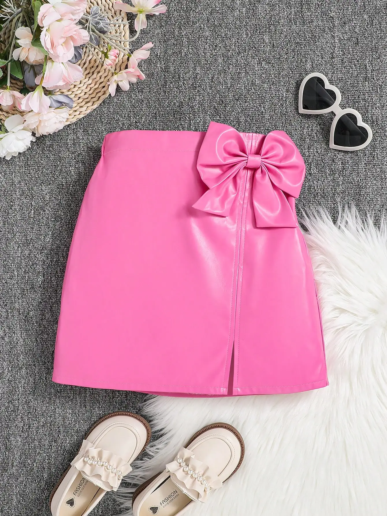 

Girls' Pink Faux Leather Skirt with Large Bow Detail and Front Slit