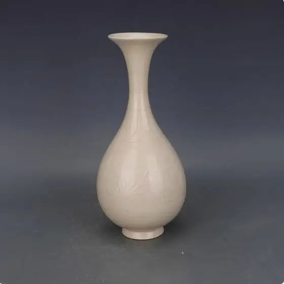 

Antique collection: Carved porcelain vase from Ding Kiln in the Song Dynasty