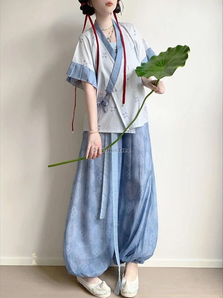 

Женский комплект ханьфу в стиле древней династии Вэй и Цзинь 2026 года: топ с короткими рукавами и перекрестным воротником, свободные длинные брюки, повседневный ретро-стиль.