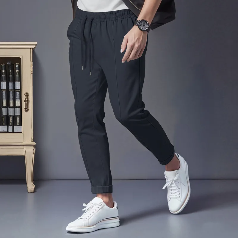 

Cross-border American autumn and winter solid color tether casual simple men's business loose slim-fitting small feet trousers