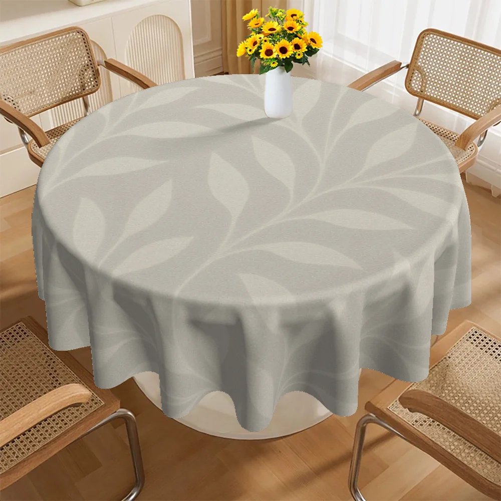 This circular tablecloth features a light grey leaf pattern and is suitable for various occasions.zyc
