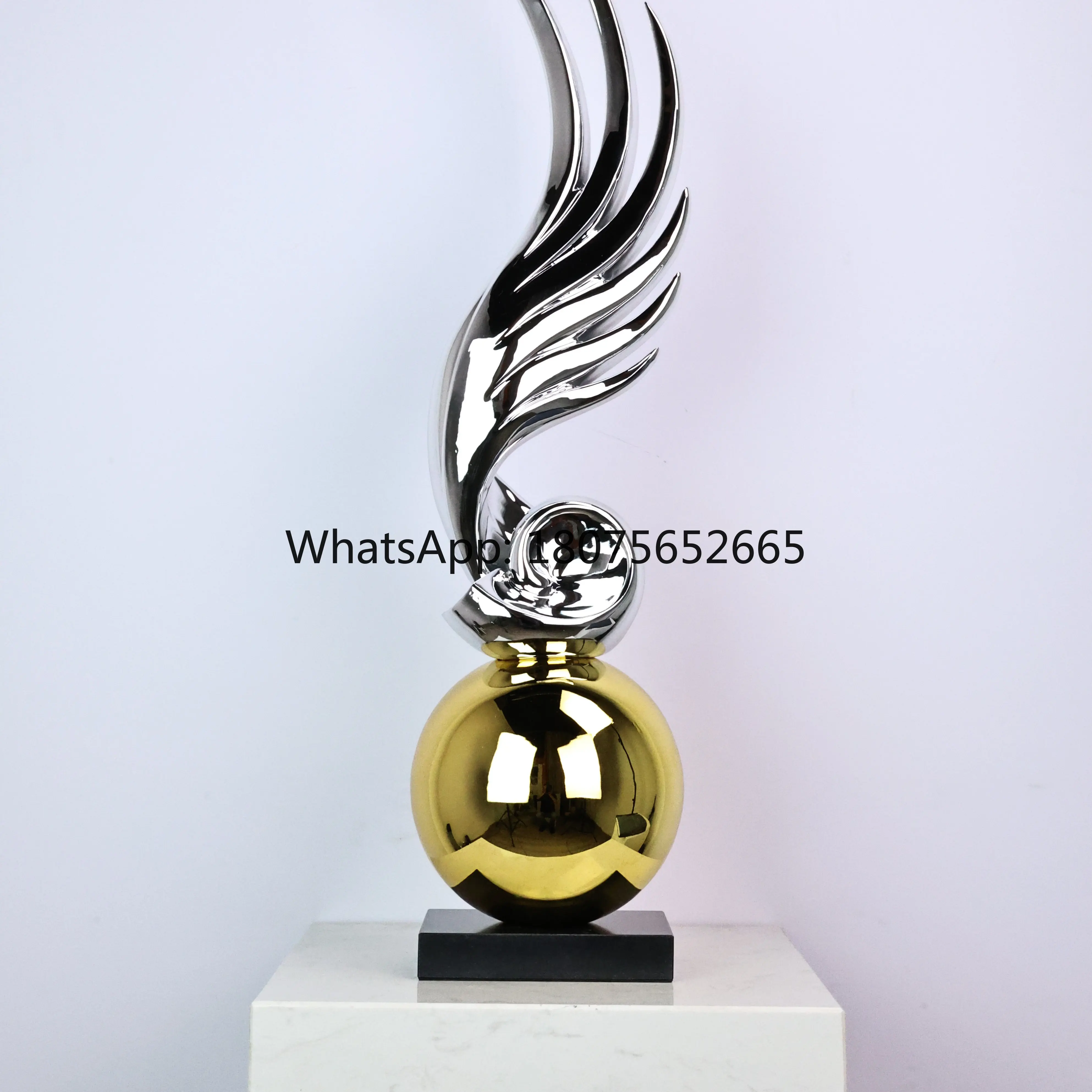Mansion-style entryway decor: modern hotel art sculpture