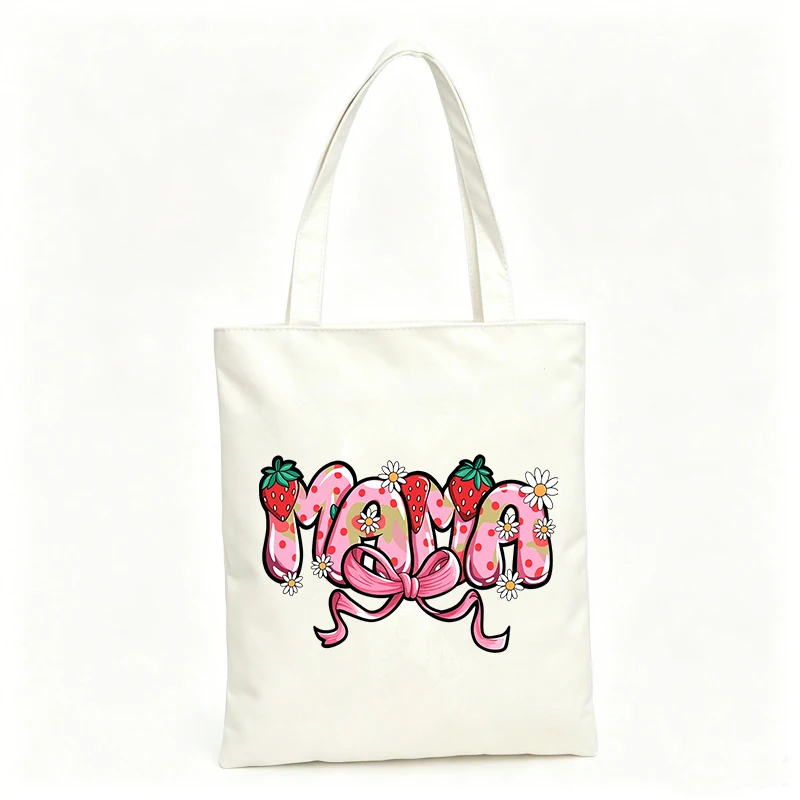 Women's canvas tote bag with strawberry and daisy graphic, perfect for casual shopping and daily use