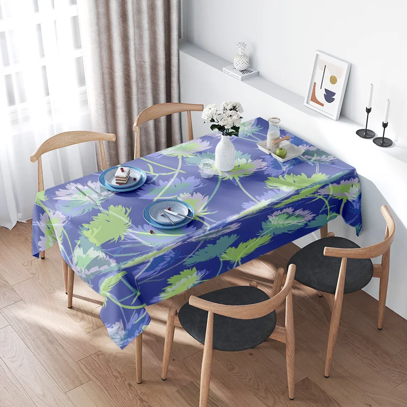 Enchanting Garden: Deep Blue Background with Green and White Floral Pattern Tablecloth for an Elegant Dining Space