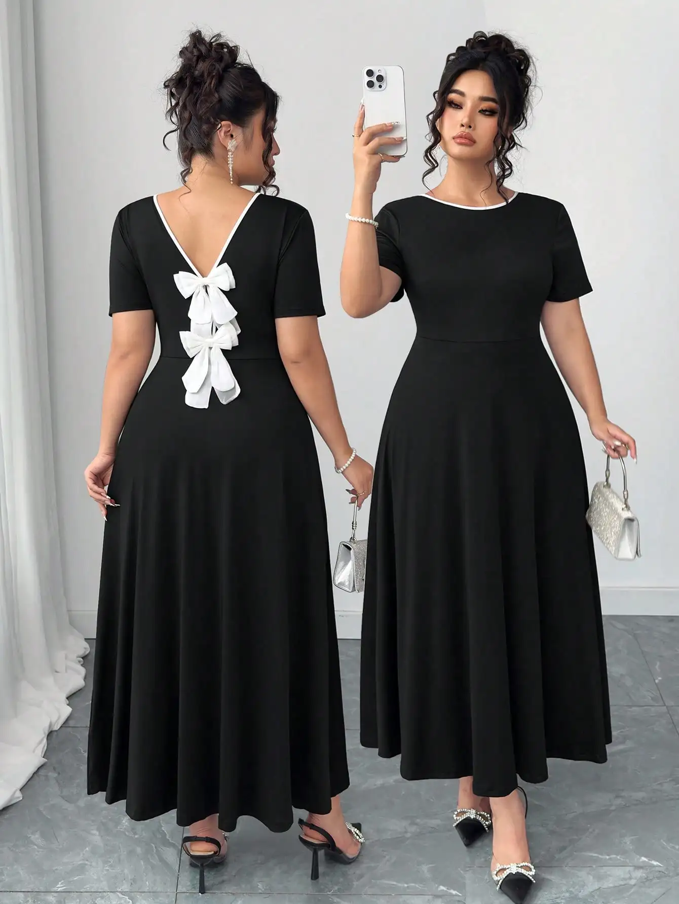 

Черное миди-платье с бантом на спине, V-образным вырезом, короткими рукавами, А-образного силуэта