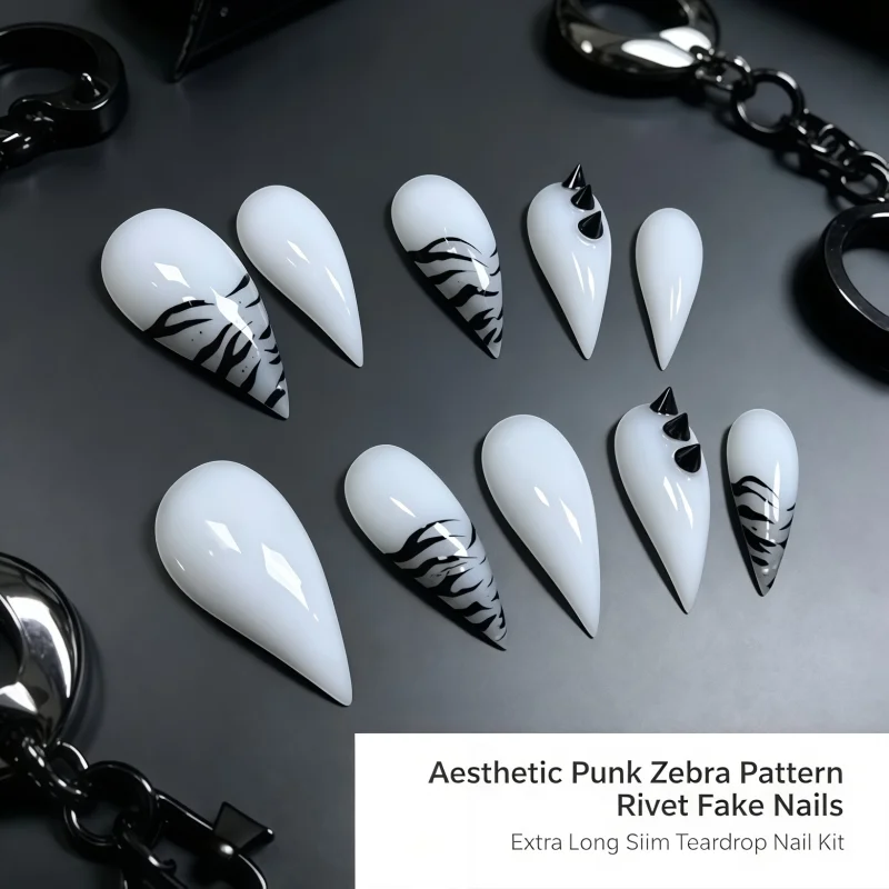 2026New 10PCS of white lacquer daggers-shaped fake nails, decorated with hand-painted abstract black ink swirl lines.